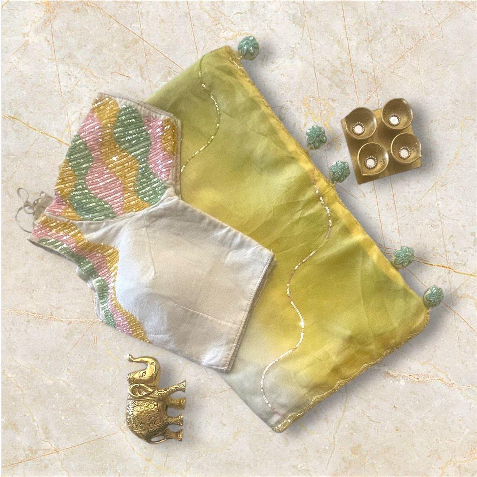 White & Pastel Blouse with Yellow-Green Saree